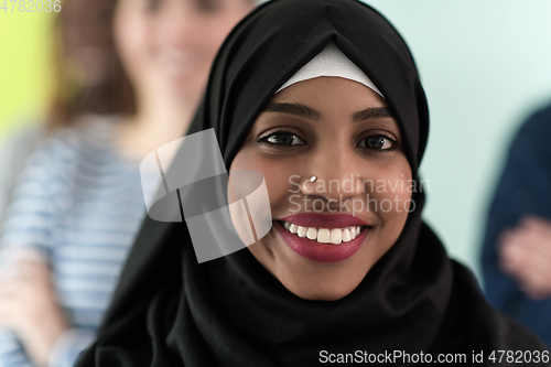 Image of group of diverse teenagers posing in a studio, determined teenagers in diverse clothing.