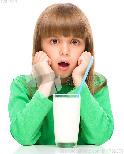Image of Cute little girl with a glass of milk