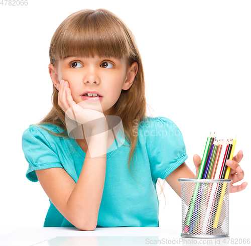 Image of Little girl with color pencils
