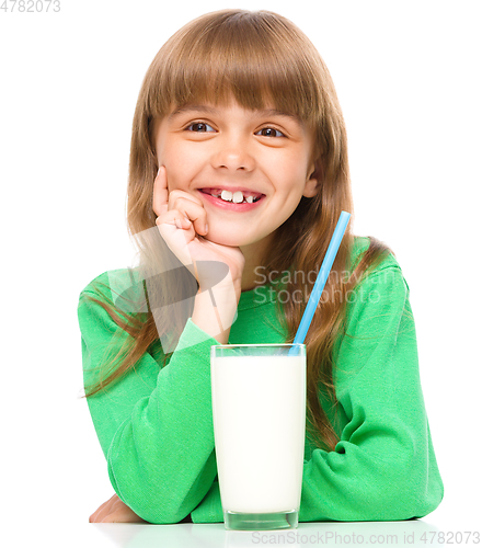 Image of Cute little girl with a glass of milk