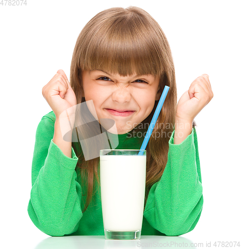 Image of Little girl with a glass of milk