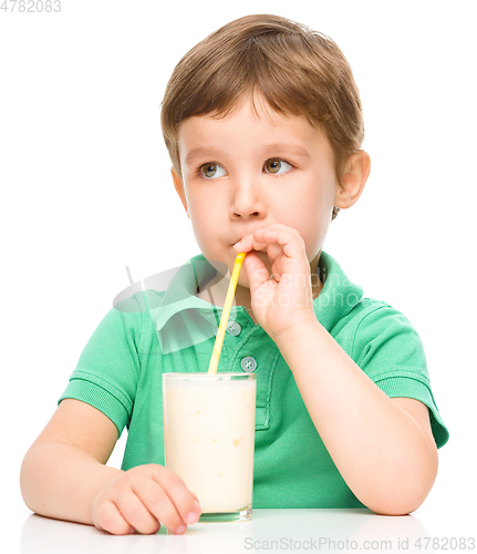 Image of Cute little boy with a glass of milk