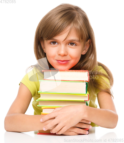 Image of Little girl with her books