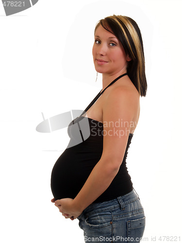 Image of Young pregnant woman with big belly in black top
