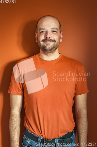 Image of man with beard orange