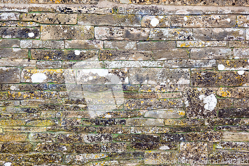 Image of old weathered stone wall