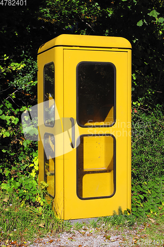 Image of vintage yellow german phone box