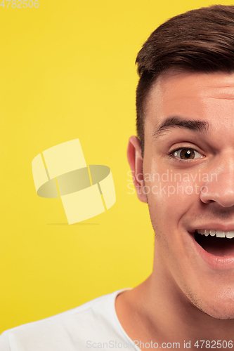 Image of Caucasian young man\'s close up portrait on yellow background