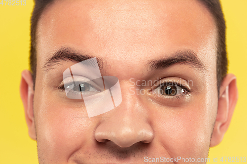 Image of Caucasian young man\'s close up portrait on yellow background