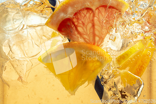 Image of Close up view of the lemon slices in lemonade on background