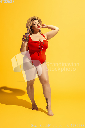 Image of Young caucasian plus size female model\'s preparing for beach resort