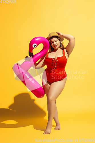 Image of Young caucasian plus size female model\'s preparing for beach resort