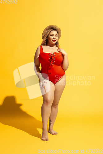 Image of Young caucasian plus size female model\'s preparing for beach resort