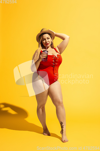 Image of Young caucasian plus size female model\'s preparing for beach resort