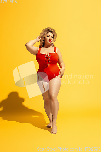 Image of Young caucasian plus size female model\'s preparing for beach resort