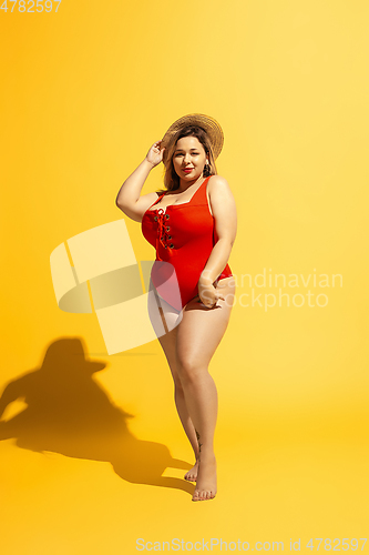 Image of Young caucasian plus size female model\'s preparing for beach resort