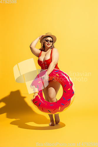 Image of Young caucasian plus size female model\'s preparing for beach resort