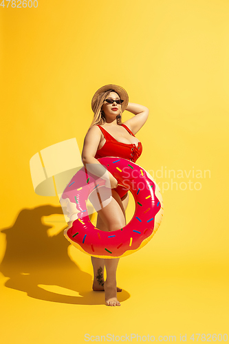 Image of Young caucasian plus size female model\'s preparing for beach resort