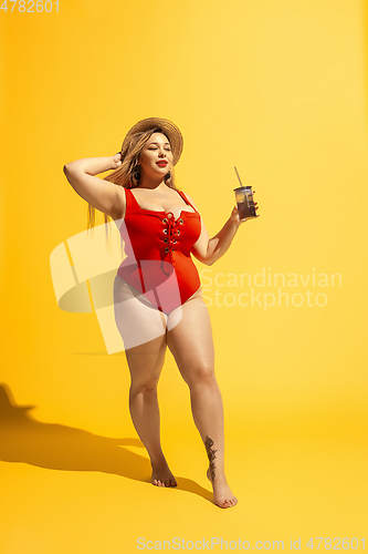 Image of Young caucasian plus size female model\'s preparing for beach resort