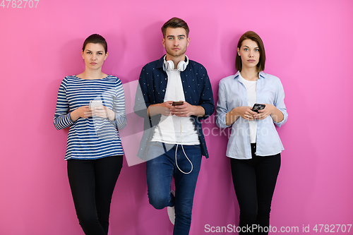 Image of group of friends have fun and dance while using a cell phone and headphones