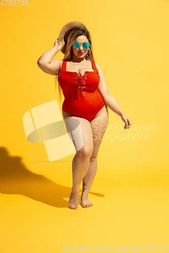 Image of Young caucasian plus size female model\'s preparing for beach resort