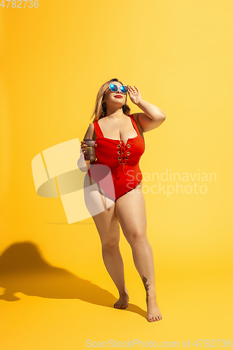 Image of Young caucasian plus size female model\'s preparing for beach resort