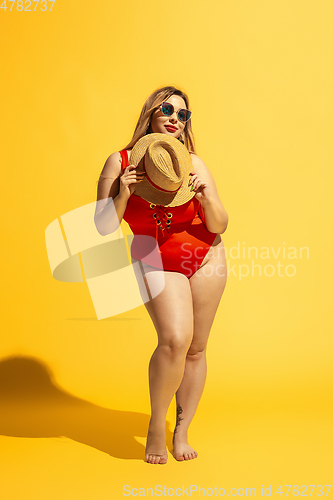 Image of Young caucasian plus size female model\'s preparing for beach resort