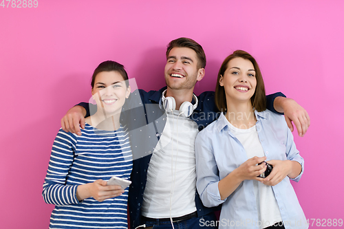 Image of group of friends have fun and dance while using a cell phone and headphones