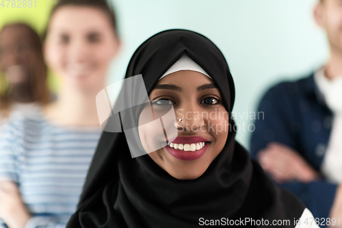 Image of group of diverse teenagers posing in a studio, determined teenagers in diverse clothing.