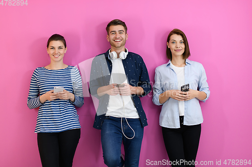 Image of group of friends have fun and dance while using a cell phone and headphones