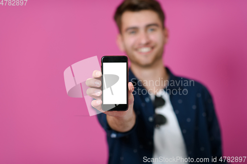 Image of covid passport a young man shows his qr code and covid19 passport on his cell phone