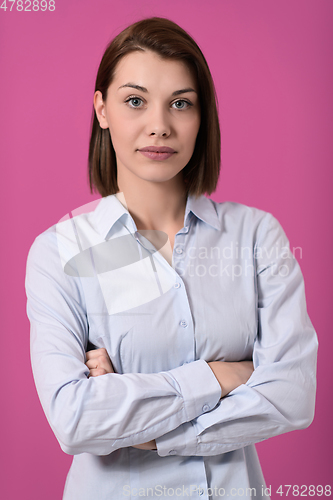 Image of Portrati shot of beautiful blond businesswoman standing with arms crossed at isolated white background.