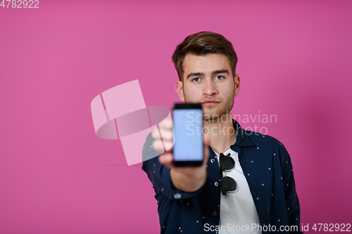 Image of covid passport a young man shows his qr code and covid19 passport on his cell phone