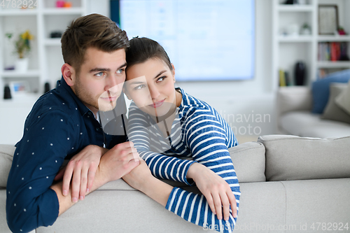 Image of a young married couple enjoys sitting in the large living room