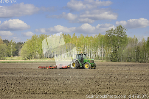 Image of John Deere Tractor and Harrow Agricultural Landscape