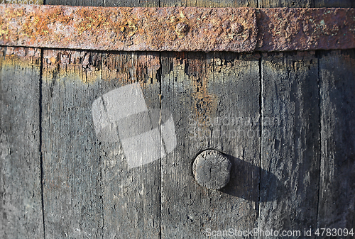 Image of Texture of very old barrel for wine with a cork and a rusty meta