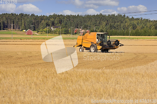 Image of Agricultural Field Landscape with Combine