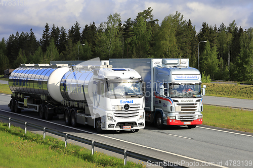 Image of Trucks Overtaking in Motorway Traffic