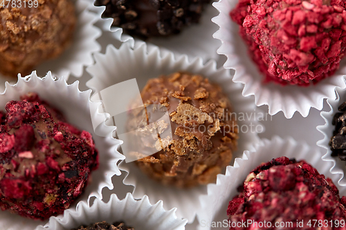 Image of close up of different candies in paper cups