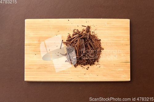 Image of chocolate chips on wooden board