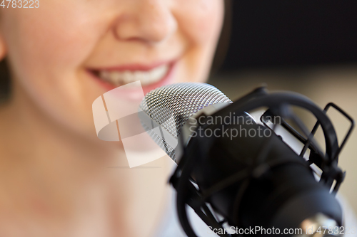 Image of close up of woman talking to microphone