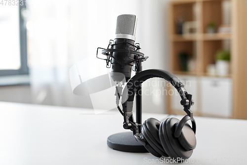 Image of headphones and microphone at home office