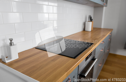 Image of modern home kitchen interior with oven and hob