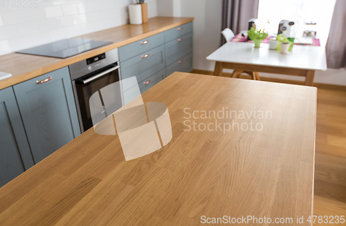 Image of home kitchen interior with counter and table