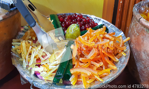 Image of Appetizing candied fruit on a large plate
