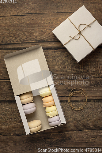 Image of Flat lay of marshmallows in a cardboard boxes in food delivery