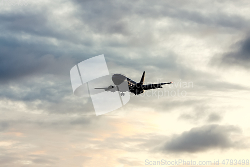 Image of air plane in sunset sky