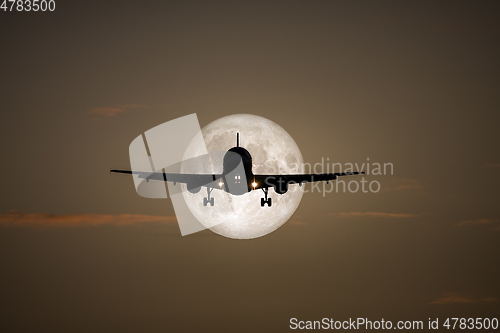 Image of air plane full moon