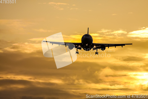 Image of air plane in sunset sky