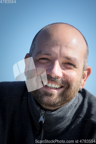 Image of man with beard portrait outdoors